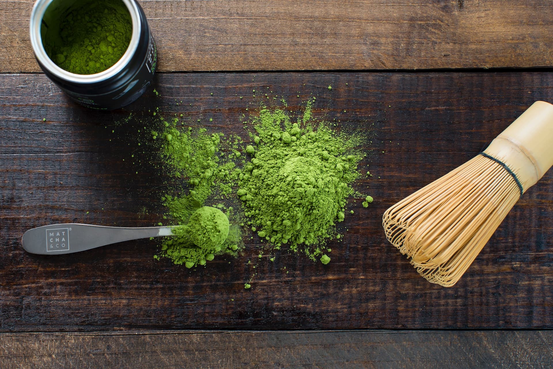 Green powder and spoon on board